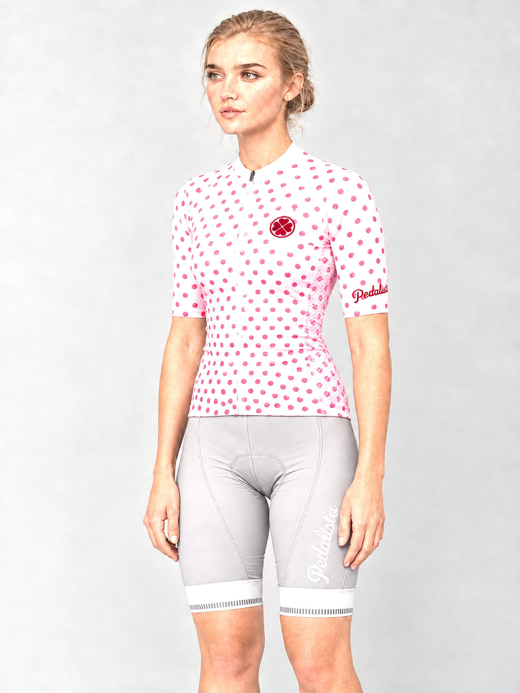 Model wearing the Queen of the Mountain jersey with silver bib shorts, side view