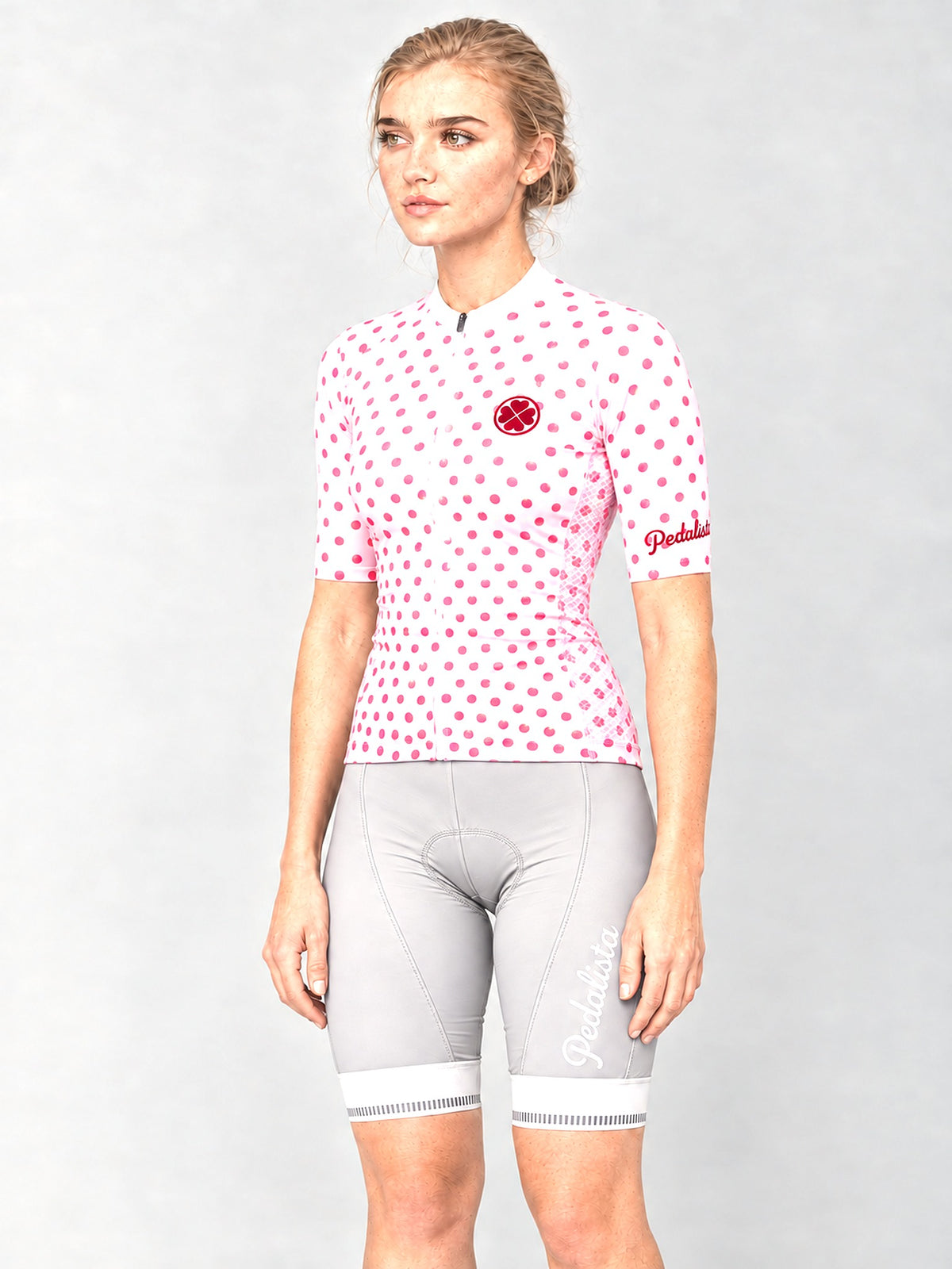 Model wearing the Queen of the Mountain jersey with silver bib shorts, side view