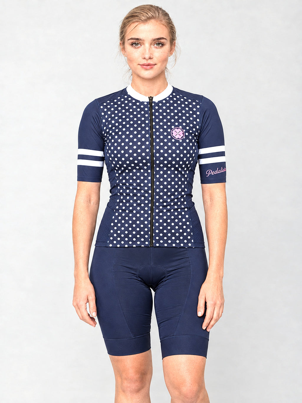 Model wearing The Jackie jersey with navy bib shorts, front view