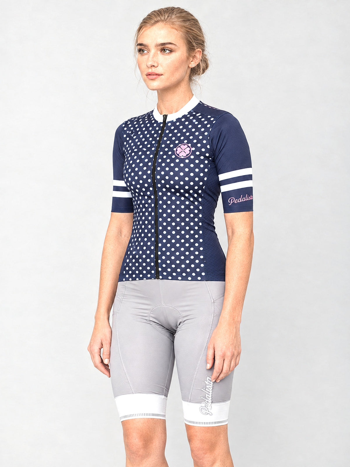Model wearing The Jackie jersey with silver bib shorts, side view